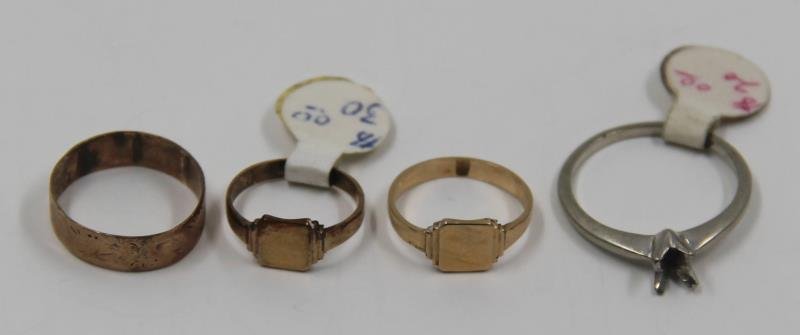 JEWELRY. Grouping of Childrens' Rings and a: Setting. Includes a 10kt gold child's signet ring, a second 10kt gold child's signet ring, a 14kt gold child's ring with worn etchings of flowers to band; and a 14kt white gold solitaire stone setting