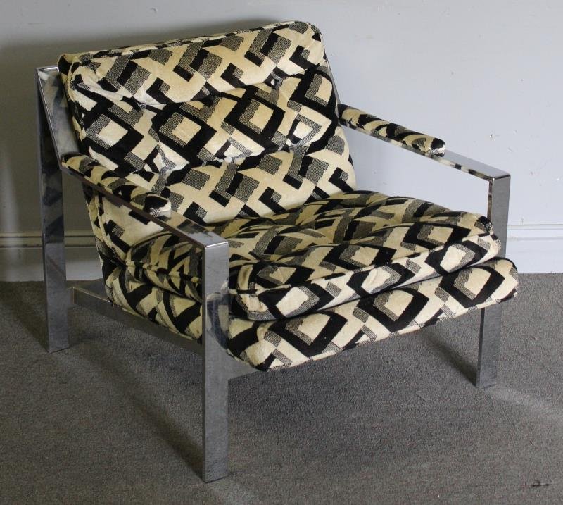 Midcentury Cy Mann Chrome Arm Chair.: In the style of Milo Baughman. Angular chrome base with upholstered seat and arm rests. Unmarked. From a Long Island, NY estate. Dimensions: 29.5" w x 33" d x 28" h. Condition: Wear to upholstery. Chr