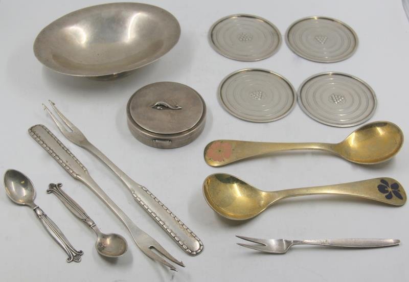 STERLING. Grouping of Assorted Georg Jensen: Silver. Includes two Georg Jensen gold wash sterling annual Christmas spoons - a 1976 Sweetbriar spoon, and a 1977 Sweet Violet spoon - stamped, "RA AB/ Sterling Denmark / Georg Jensen; a sterling ova