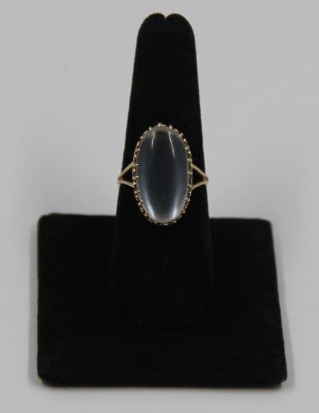 JEWELRY. 10kt Gold and Moonstone Ring.: By consignor provenance this ring was purchased from the estate of Doris Duke. Ring size - 7 1/2. Total approx. weight is 3 dwt. From a Princeton, NJ estate.