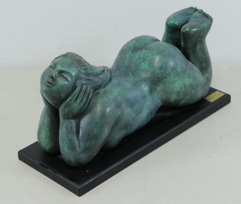 PALDI, Kati. Bronze. Reclining Female Nude.: Signed and numbered 11/12 on leg. Kati Paldi (Israeli, b.1931). From a Lawrence, NY estate. Dimensions: 7.25" high x 16" wide x 5.5" deep + base Condition: Good, a few surface spots, can be cleaned.