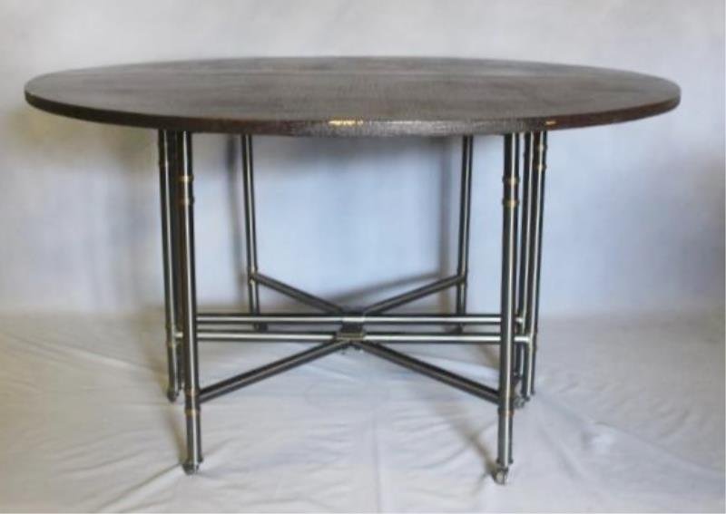 Linen Wrapped Table With Gun Metal Base.: A nice quality and decorative table in the style of Karl Springer. From a Stamford, CT estate. Dimensions: 54" diameter x 29" h closed.Condition: Overall good with small scuffs to one edge.