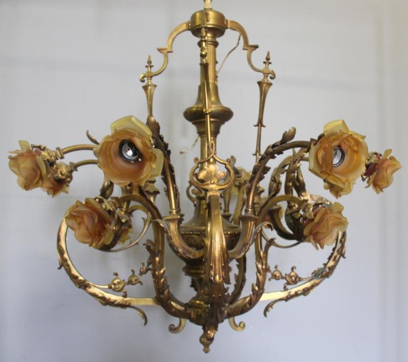 Bronze Chandelier with Frosted Glass Rose Form: Shades. From a Manhattan, NY estate. Dimensions: 35" diameter x 33" high.