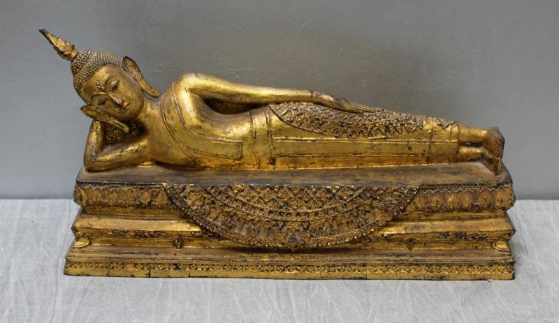 Antique Gilt Metal Reclining Buddha.: From a Westhampton L.I. estate. Dimensions: 20" w x 5.5" d x10" h. Condition: good.