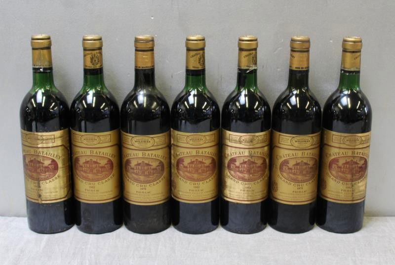 7 Bottles Chateau Batailley Grand Wine 1982.: 7 Bottles of Chateau Batailley Grand 1982. Into neck and top shoulder fill. From a Long Island, New York Estate. Condition: Disclaimer: Clarke Auctions accuracy in description is best to our knowledge