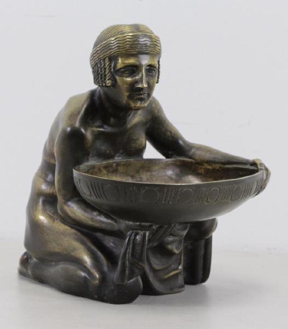 GURSCHNER, Gustav. Deco Bronze Bowl Bearer.: Signed on back and stamped "Made in Austria'. Gustav Gurschner (Austrian, 1873 - 1970). Dimensions: 10" high x 8.5" wide x 10" deep. Condition: Good, nice patina.
