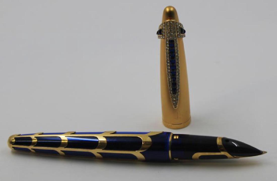 GOLD. Boucheron for Waterman Sapphire and: Diamond Fountain Pen. Waterman limited edition Boucheron fountain pen in blue and gold. With a custom cap and clip inlaid with bands of graduated sapphire cabochons and round brilliant cut diamonds se