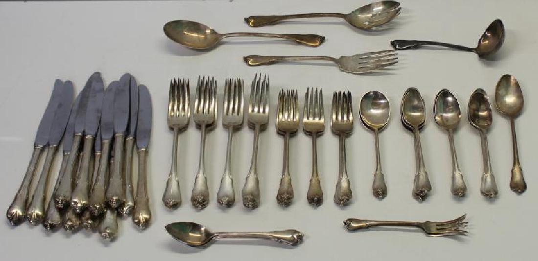 STERLING. Wallace Grand Colonial Partial Flatware: Service. Includes 12 knives - 8 7/8" in length, 2 lemon forks, one ladle, 3 fruit/orange spoons, 13 forks - 7.25" in length, 10 salad forks, 2 soup spoons, one oval soup spoon, 10 teaspoons, a pierced