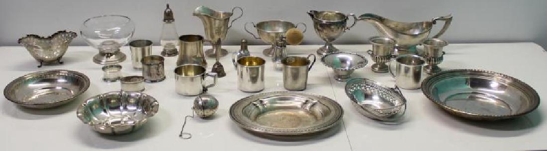 STERLING. Grouping of Silver Hollow Ware.: Includes a footed bowl with pierced border; a Watson Company basket with pierced border; sterling gravy boat; a miniature weighted sterling pedestal urns; a monogrammed sterling sugar and creamer - wi