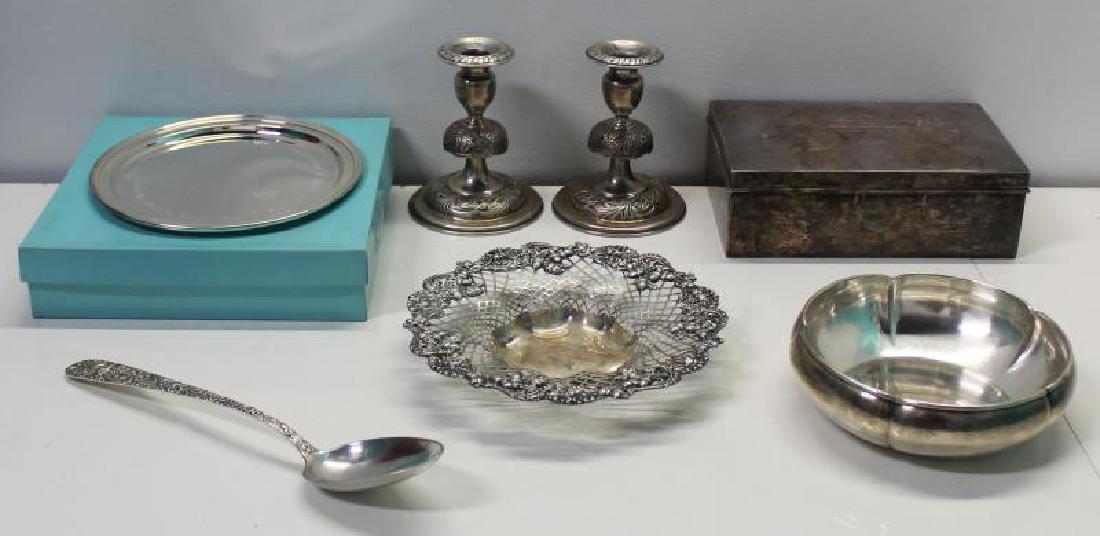 STERLING. Assorted Grouping of Silver Hollow Ware.: Includes a pair of hand chased sterling candlesticks with floral decoration; a S. Kirk & Son stuffing spoon; an openwork sterling bowl with acorn decoration to border; a The Kalo Shop hand wrought ste
