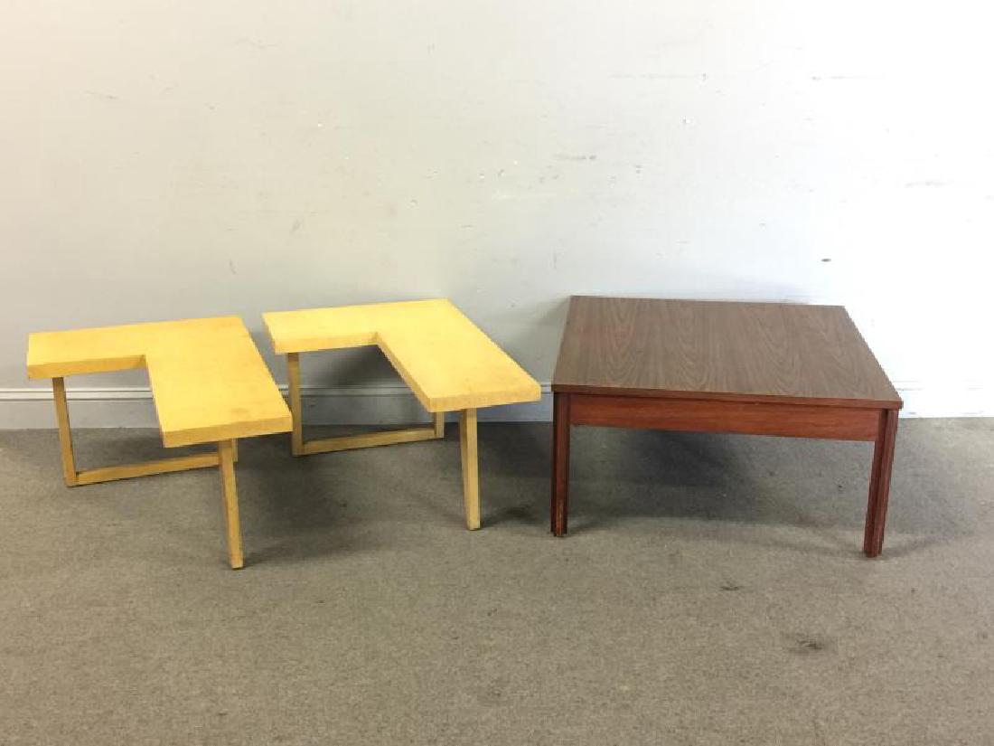 Midcentury End Table / Coffee Table Lot.: Includes a pair of L shaped light finish tables, unmarked. Together with a John Stuart labeled laminate top coffee table. Dimensions: L-shaped - 33" w x 22" d x 16.5" h; Coffee Table - 32" w x 32" d x