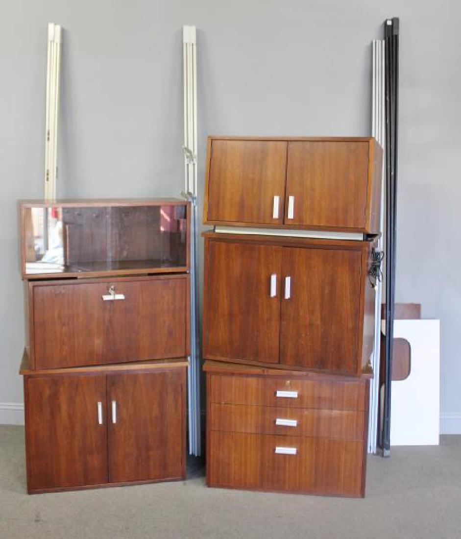 Midcentury Tension Wall Unit with Lighotlier.: Includes 6 Cabinets and a Shelf. Cabinets include (3) two door cabinets, (1) drop front bar, (1) three drawer, and (1) sliding glass door. Multiple bays with aluminum and some black finished extra bay