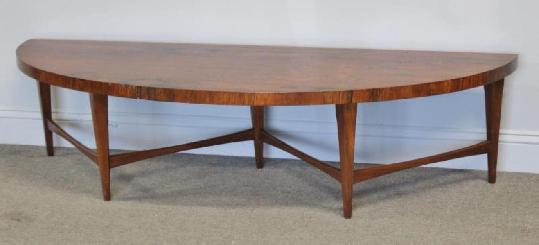 Midcentury Danish Rosewood Demilune Coffee Table.: Platform or coffee table in demilune form with stretcher and tapered leg base. Unmarked. Nice asymetrical graining and coloration to top. From a Harrison, NY estate. Dimensions: 63" w x 22" d x 15.5" 