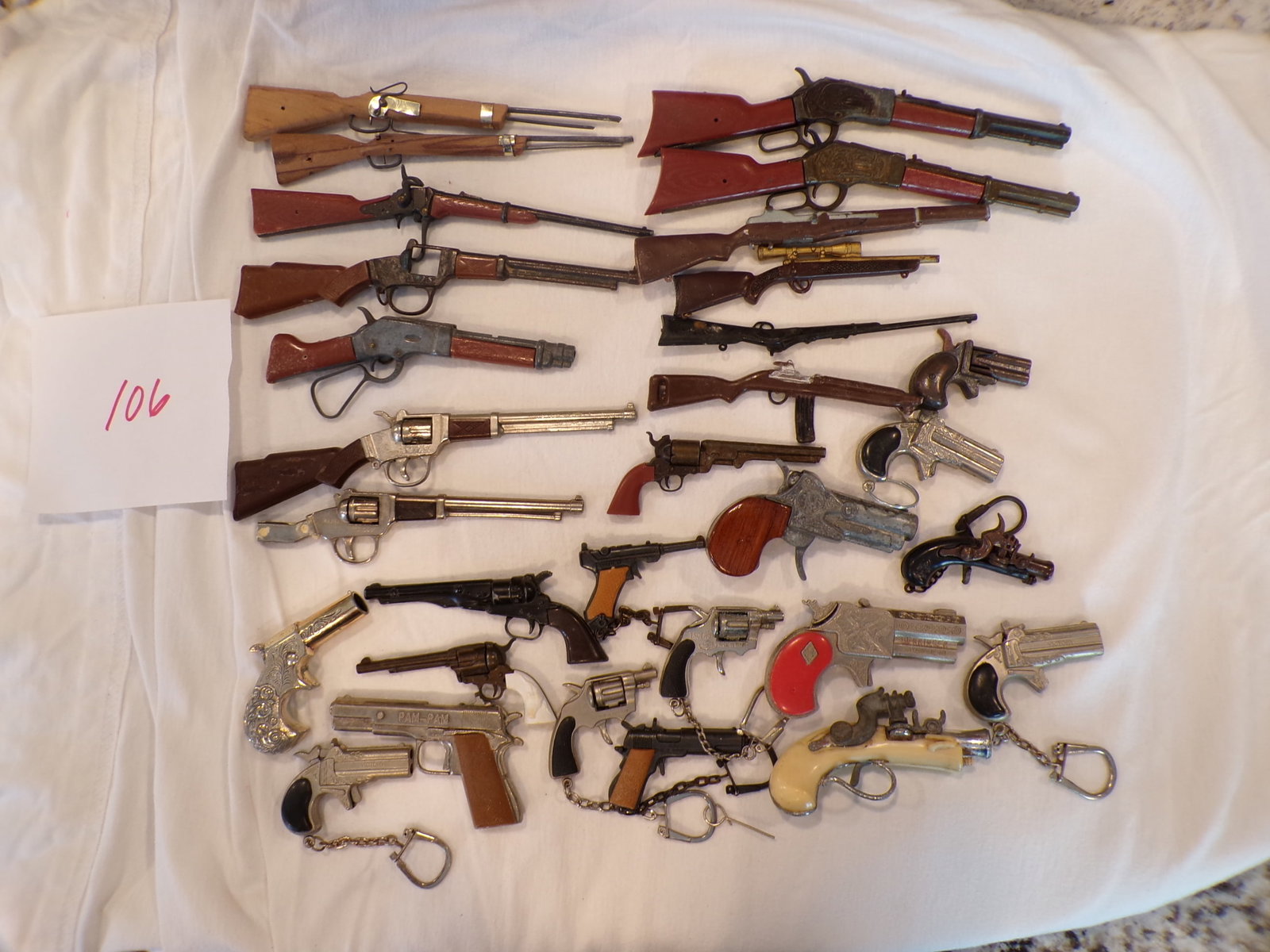 LOT OF TOY GUNS: AS SHOWN IN PICTURES