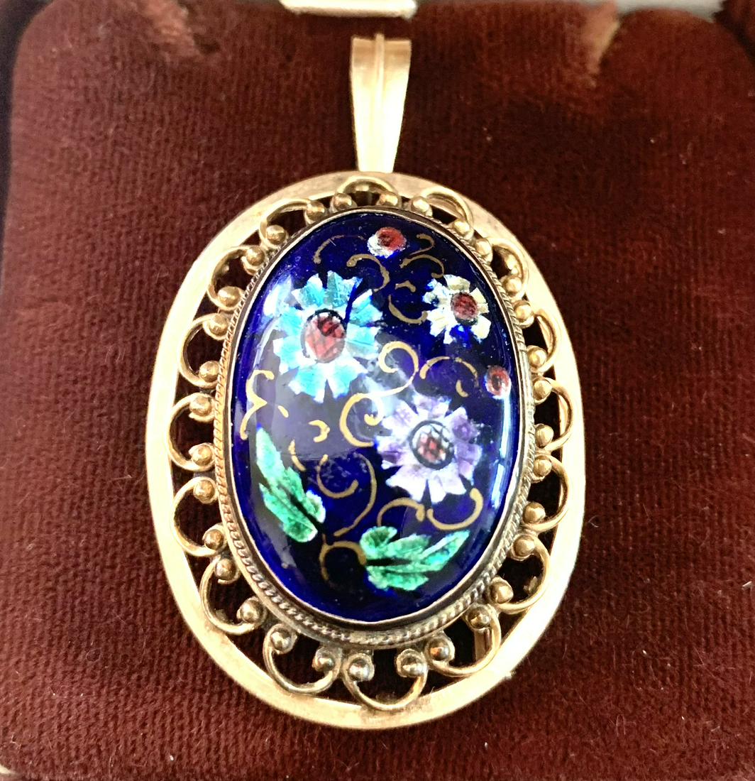 Antique 14K Solid Enameled 2" Large Pendant 16.7 grams: An oval pendant with a bezel set enameled center of multi colored flowers on a dark blue background. An elaborate swag contour surround. It served as a broch one time and the previous owner clipped th