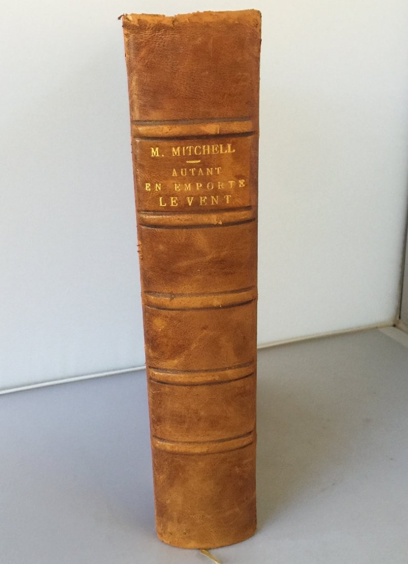 Gone with the Wind by Mitchell 1st/1st French Edition: This is the French 1st edition 1st printing of the famous novel Gone with the Wind. Titled Autant Emporte Le Vent published by Gallimard in 1938. Bound in half leather, has the original covers. A scar