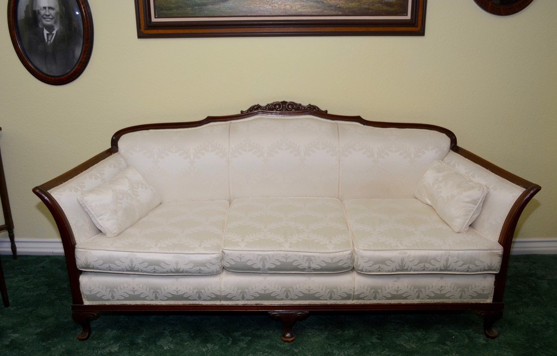 Early 1900's Antique Duncan Phyfe Sofa, Rolled Arms: Period sofa with rolled arms, wood back rail, carved front legs on brass paw castors, matching pair with the armchair, size is 34" tall (from floor to couch) l x 26" deep x 75 wide.