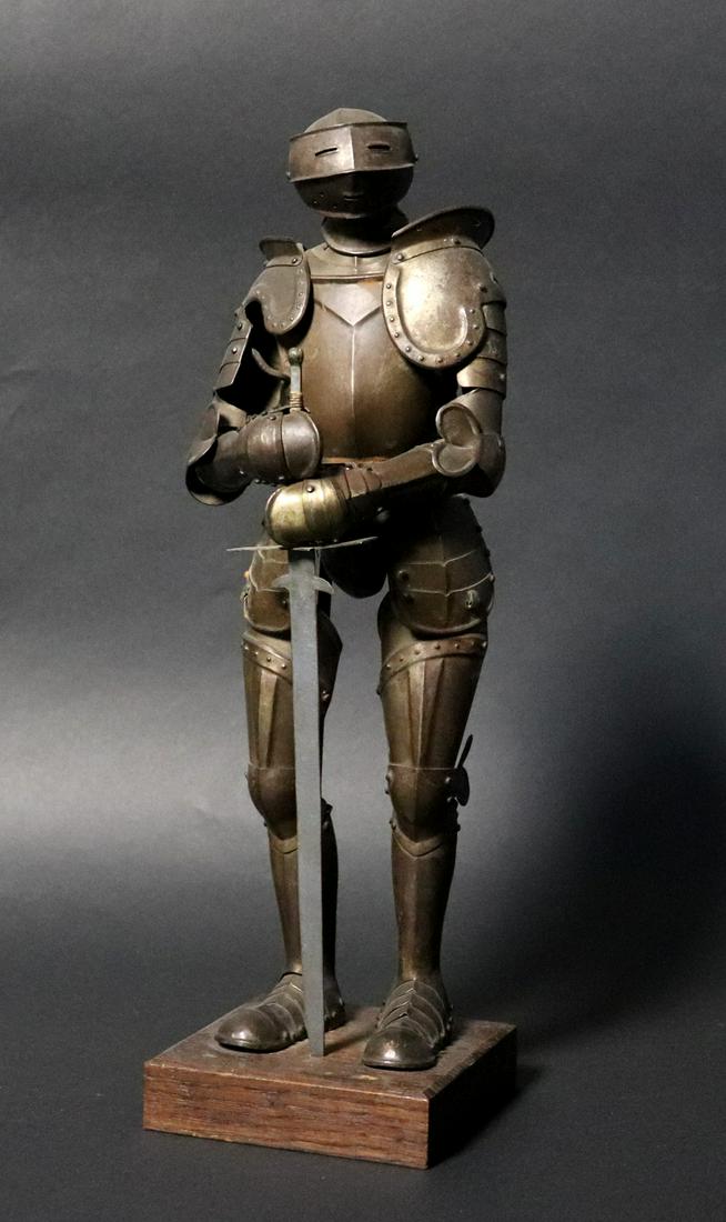 Miniature Suit of Armor: A miniature suit of armour in the 16th century style with sword. 16" H x 5" WCalifornia arms collector