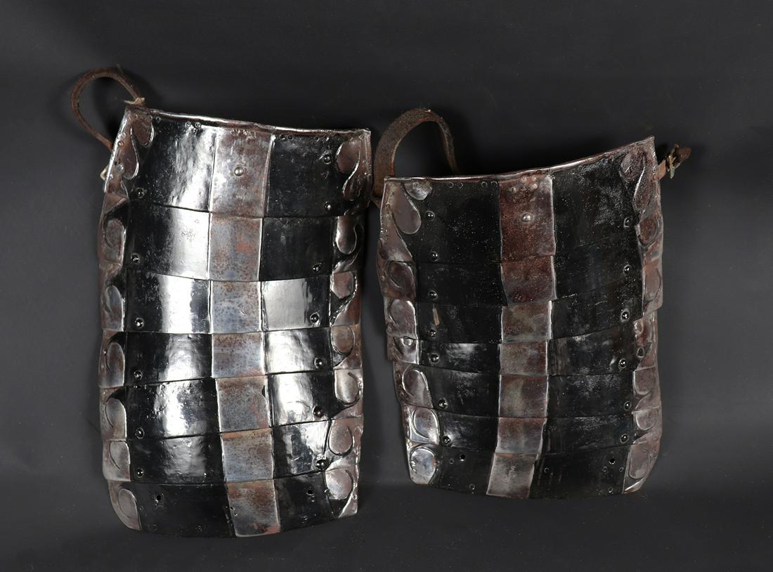 Black & White Armour Tassets, 19th C.: 19th century or earlier set of black and white armour tassets with later restoration of enamel. Larger 14" L