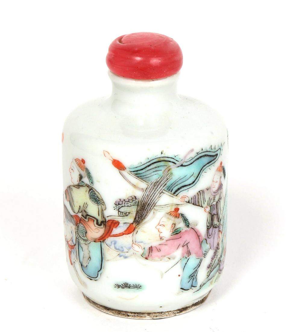 Chinese Porcelain Snuff Bottle: Men on horse back ride through a city, wearing robes with rank badges implying they are warriors. It appears to be a celebration of return as people follow on foot with banners and goods to offer. The