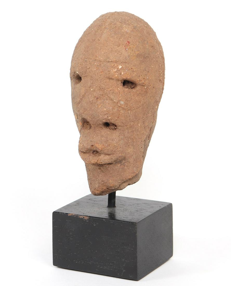 Male Nok Head, 1500 BCE-500 CE: West Africa, Nigeria, Nok Village / Religion, Nok head fragment made from terra cotta, portrayed with flared nostrils, and an open mouth suggesting the deep inspiration and exhalation associated with