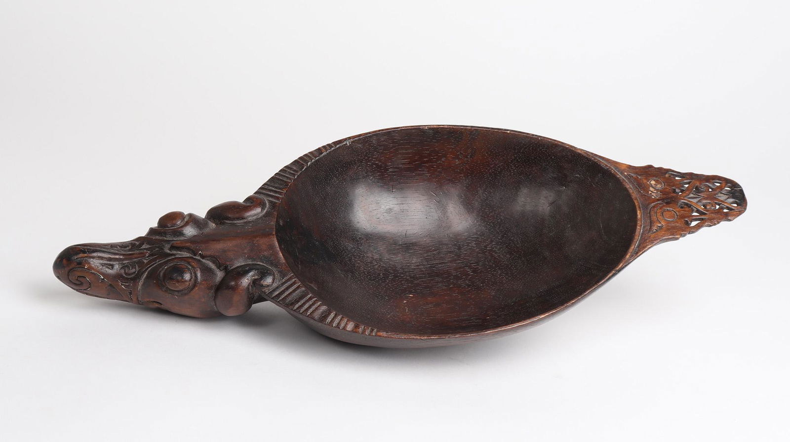 'Dog Dragon' Dayak Peoples Bowl, Borneo: Dayak Peoples, 'Borneo' bowl, iron wood in the style of early 1900s examples. Dayak Shaman used bowls for various purpose including tattooing, medicinal herbs, and rice. Carved in 'Dog Dragon' form h