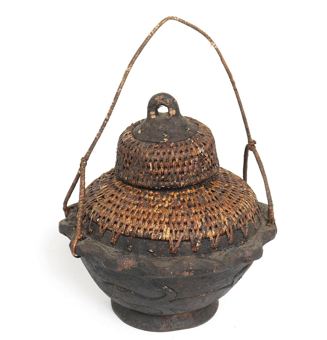 Ifugao Woven Lidded Covered Star Bowl: Ifugao star bowl with woven rattan covering, lid and handle. Starbowl features carved lizard designs. 8 1/4" W x 8 1/2" H