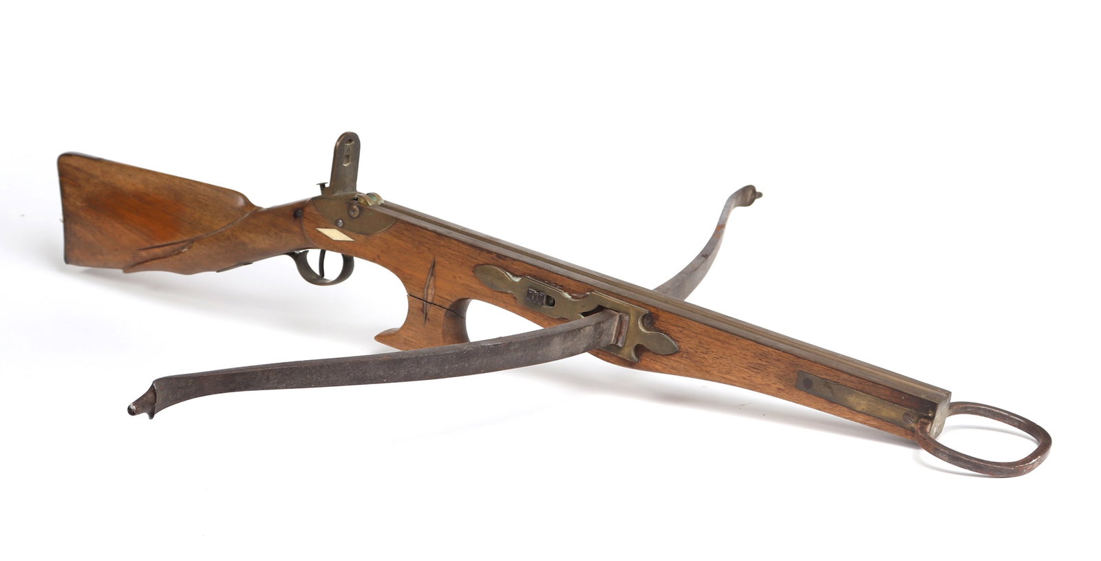 Early English Crossbow, Late 19th C.: United Kingdom, English Crossbow late 19th c. with a hardwood rifle butt stock or tiller carved with some inset panels of bone, bow irons and prod in steel and brass with missing rope, stirrup round i