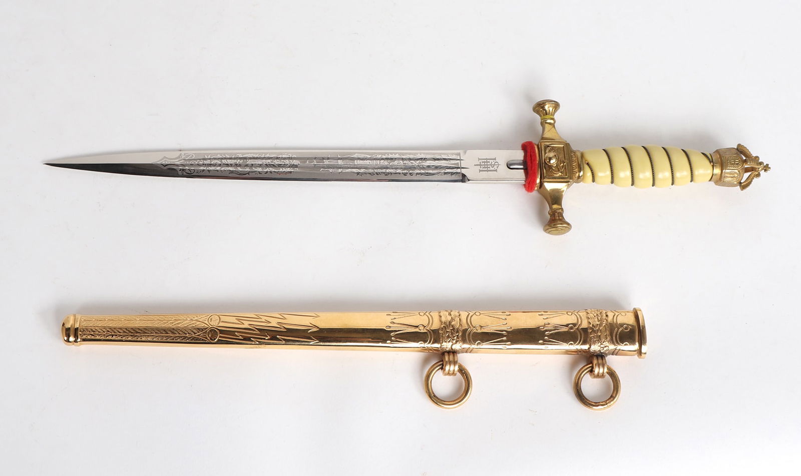 Gilt Brass Imperial German Officers Dagger, Post WWII: Post WWII, constructed in Germany after the war in the style of the Imperial German Naval Officers daggers with an intricately etched blade, holler, and high polished gilt brass scabbard and mounts, t