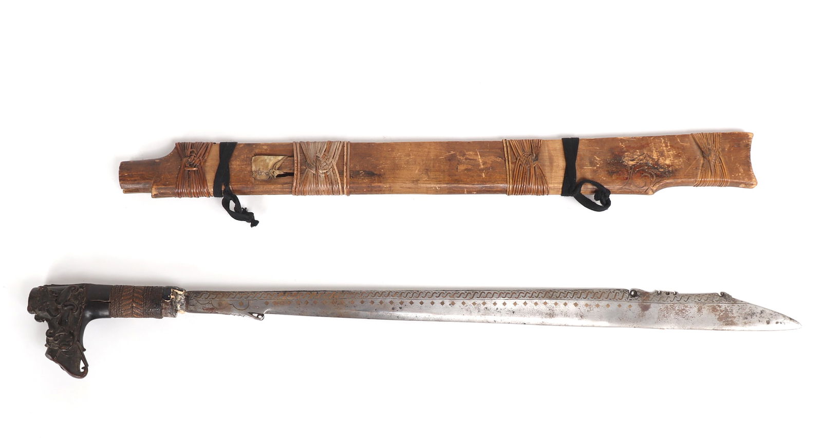 "Mandau" Dayak Headhunters sword, 19th C.: Islands of Southeast Asia or The Insular Region, Indonesia, Dayak Peoples 19th century, Kalimantan headhunters (Mandau Slang) sword with sheath, a traditional weapon of the Indonesian archipelago the