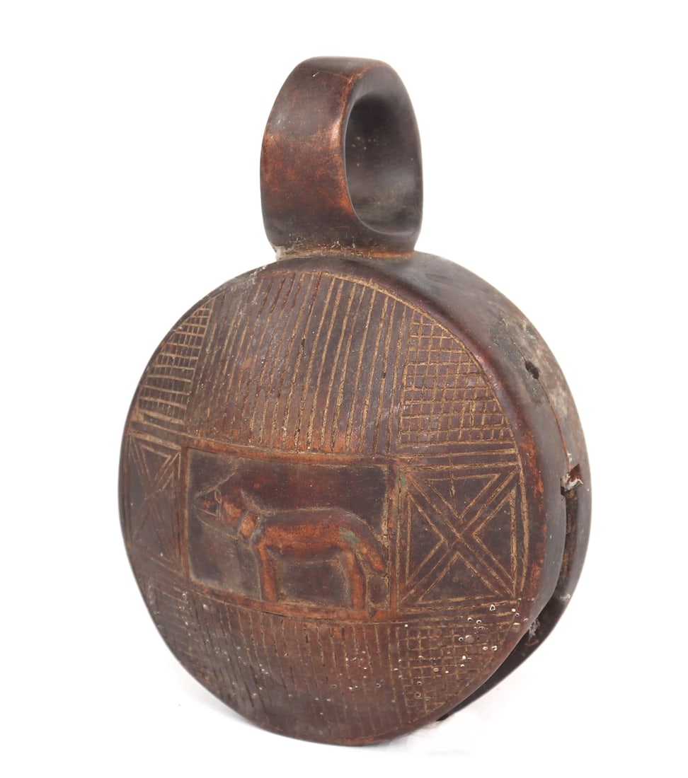 African Dibu Carved Dog Bell, Yombe Peoples 20th c.: Central African, Zambia / Congo/ Democratic Republic of the Congo / Angola, Yombe Peoples 20th c. African carved wood dog bell decorated in incised patterns of geometric shapes and with a dog to the f