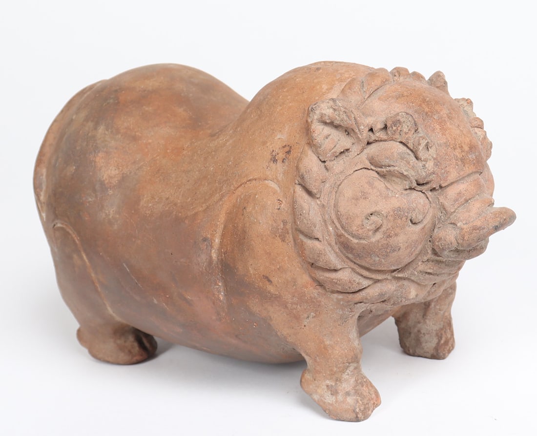 Ancient Majapahit Pottery Piggy Bank: Lovely rare example plump red clay piggy bank, circa 15th century AD. Corpulent form with a large hollow belly to keep your currency safe inside, incised with decorative and lively detail throughout.