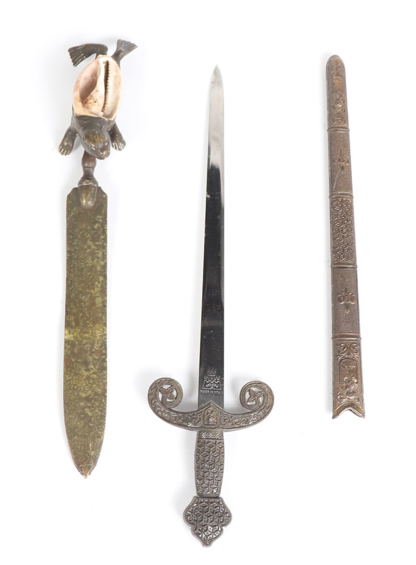 Pair of Letter Openers: Pair of letter openers including one featuring a turtle handle design with shell inlaid to form the turtles back. The other in the form of a dagger from Toledo, Spain. Largest 10 1/4" L