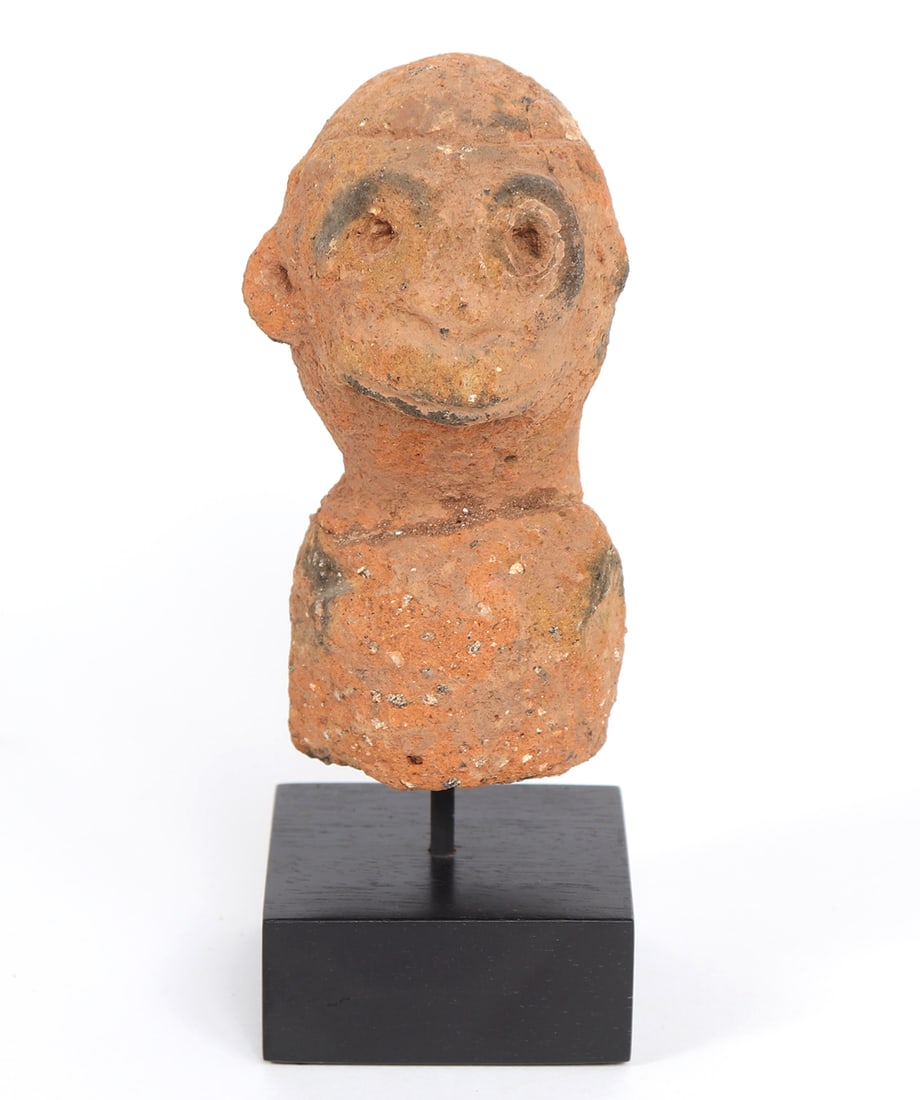 Magnificent Nok Head and Torso: Approximately 500 BCE to 200 CE fragmented terracotta head, neck and torso with pitted eyes and slit mouth. Black pigment around the eyes and shoulder. Size 7 3/4" on include custom stand, figure 5 3/