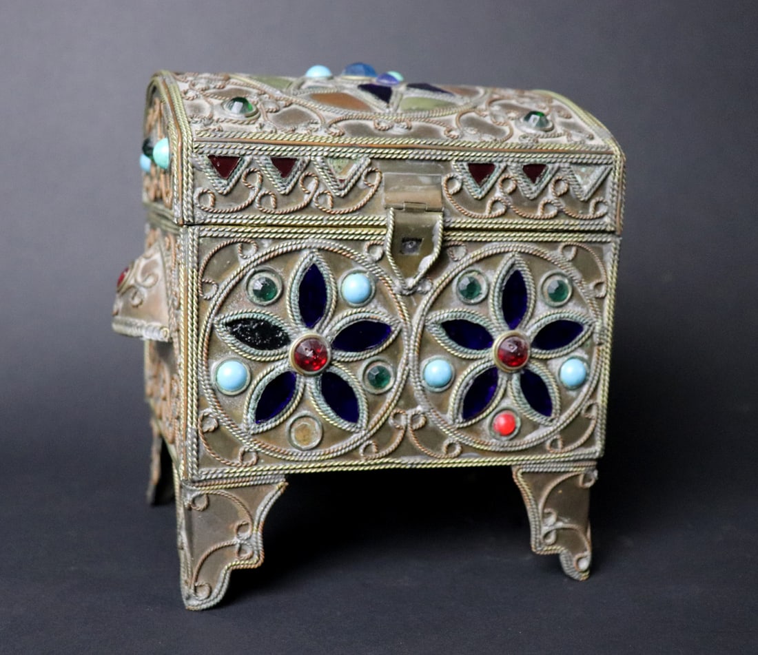 Glass Inlaid Jewelry Casket: Decorative glass inlaid jewelry casket made of brass with colored glass and stone like cabochons. 7" W x 7.25" H x 5" L