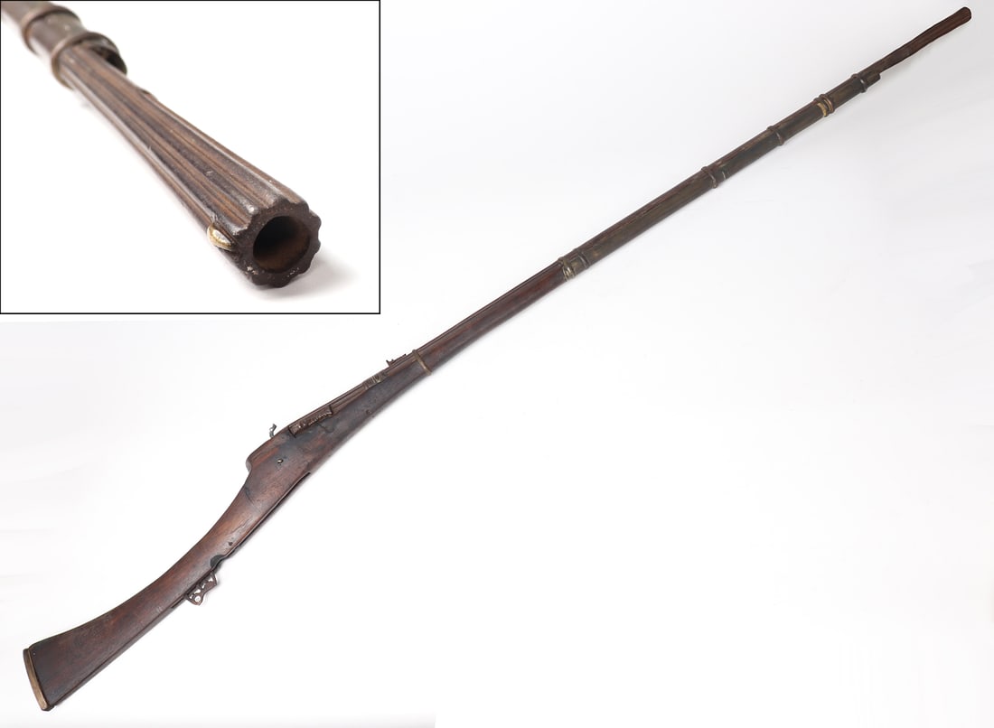 Omani "Abu Fitila" Fluted Matchlock Long Gun Rifle, Circa 1600s and later: Middle East, Omani Maritime Empire, Circa 1600s barrel and iron mounts, stock probably later as the barrels were often reused due to their exceptional construction. Early fluted barrel being of fine c