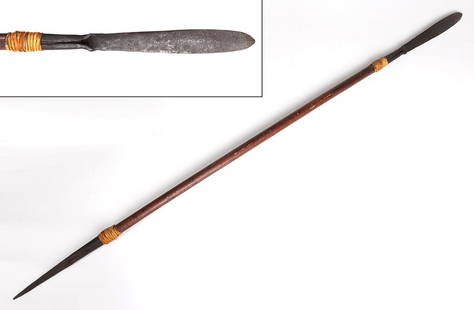 Philippines Rattan Wrapped Sibat: Filipino war spear with heavy wood shaft. Blade of iron, thickened at distal end and tapering toward shaft, hardwood shaft ferruled with rattan and punched with brass rivets. Size 53" H, spear blade