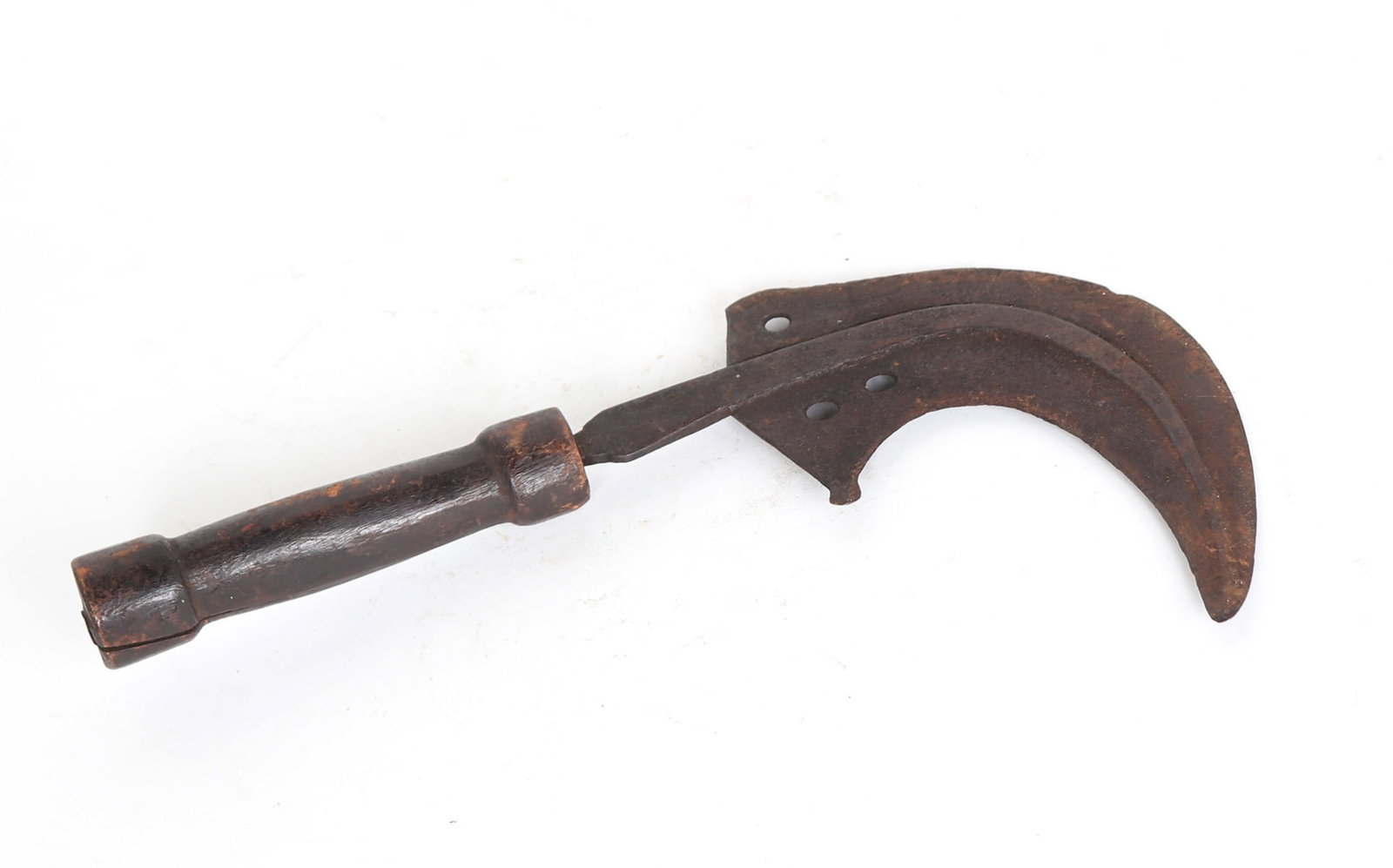 African Heavy Hand Sickle, Ivory Coast: Wide curved hook blade pierced to the base with several punches and fixed to a wood handle. Size 13 1/4" H overall, blade 7 1/4" H x 8" W