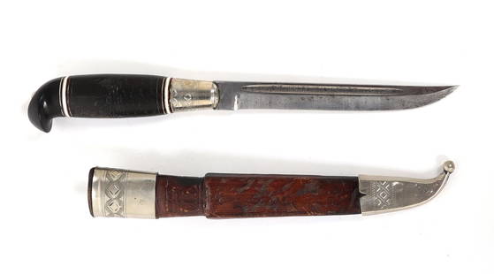 Finnish Knife w/ Scabbard: Inscribed Finnish knife in sheath with handle in black with red and white bands. The handle incised with a wolf and scenic forest background. Signed to the ricasso Finland and inscribed to the fuller