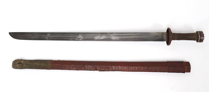 Early Tibetan Dpa'dam Battle Sword: Heavily detailed and handsomely smithed Tibetan Dpa'dam battle sword with leather scabbard. Pommel and grip intricately decorated with copper inlays and banding. The ray skin wrapped wood grip with