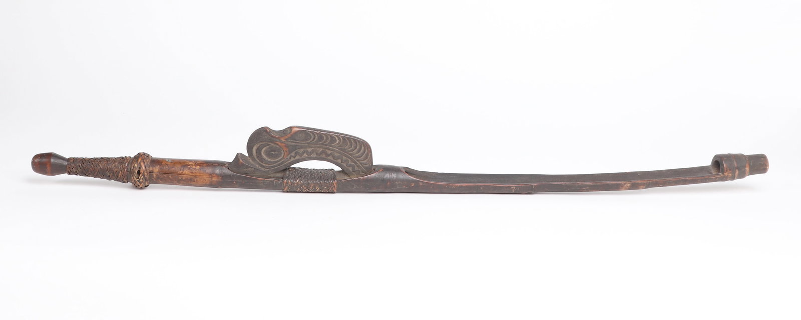Rare Carved Atlatl, Spear Thrower: Wombun Village, Chambri Lakes region of Papua New Guinea. Carved wood Atlatl carved in various elements of wood and bound with rattan bamboo and decorated with an ornately carved crocodile handle. Siz