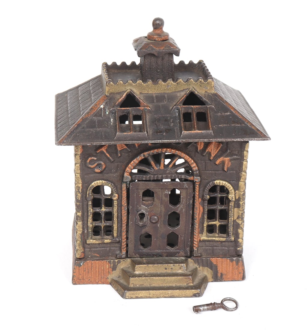 Antique Cast Iron State Coin Bank: Heavy cast iron burglar resistant coin bank with key for extra security. Coin slot on the reverse and a twist release to base to allow for all your coins to be released at once. Size 5 1/2" H x 4 1/2"