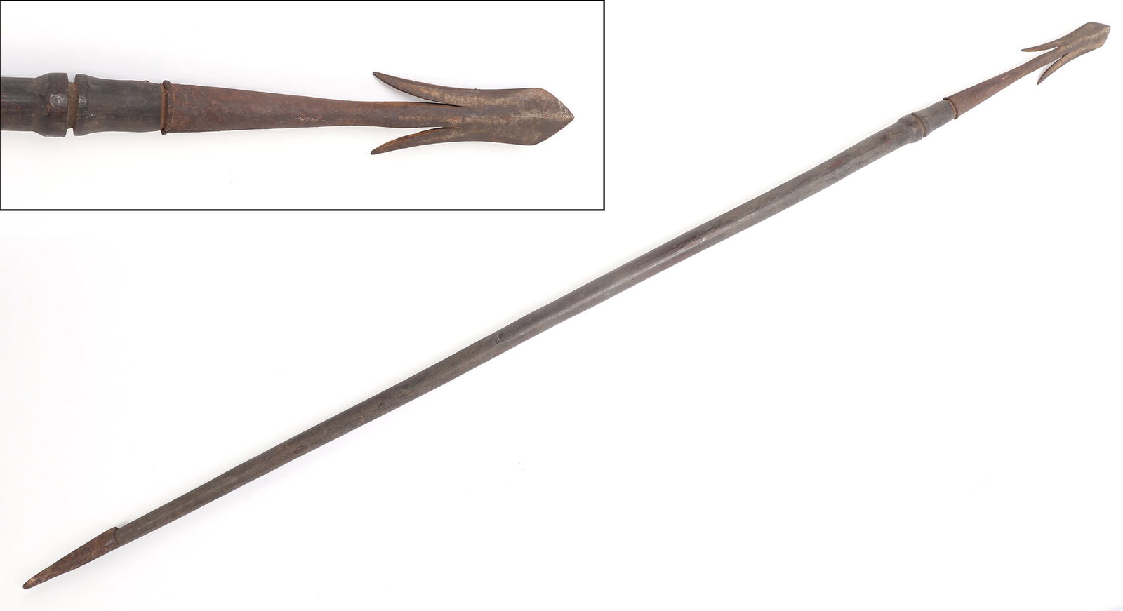 Philippine Igorot Falfeg Harpoon or Spear with Spiked Base: Philippine, Cordillera Administrative Region, Igorot Falfeg type spear or harpoon with a bulbous double edged top and flared side spikes. The ebonized shaft long and smooth with an iron spiked base. S