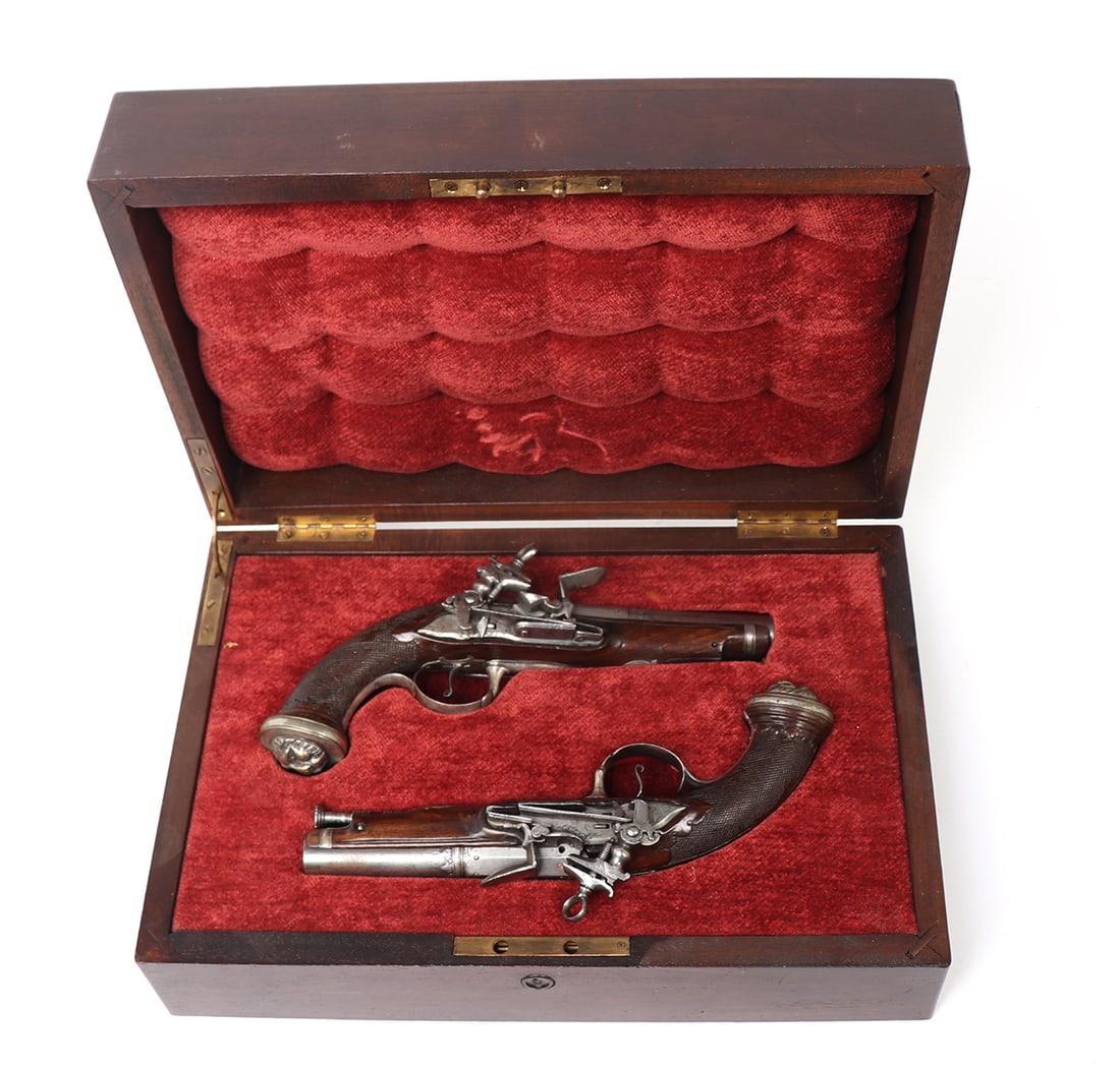 Fine Pair of Italian Miquelet Flintlock Pistols: Fine pair of cast Italian miquelet flintlock pistols, signed P. Greco to the silver mounted lion-head butt plate and signed double spring locks and engraved lock plates by P. Feo. Frizzen dated 1813 i