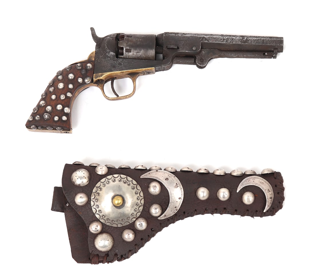 Fantastic Old West Silver Mounted Colt 1849 Pocket Revolver .31: 1849 North American Colt Revolver heavily decorated in the period to the grips and holster with tribal silver mounts of round tacks and crescent moons. Colt 1849 (.31 caliber with stagecoach scene on 