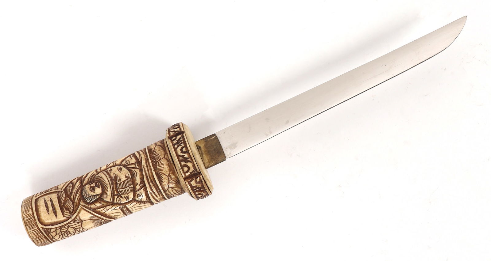 Japanese Bone Engraved Tanto Dagger: Japanese bone engraved Tanto dagger with single edged blade and matching scabbard. Tanto were used by samurai as a secondary weapon, often as a tool for close-quarters combat or for ritualistic purpos