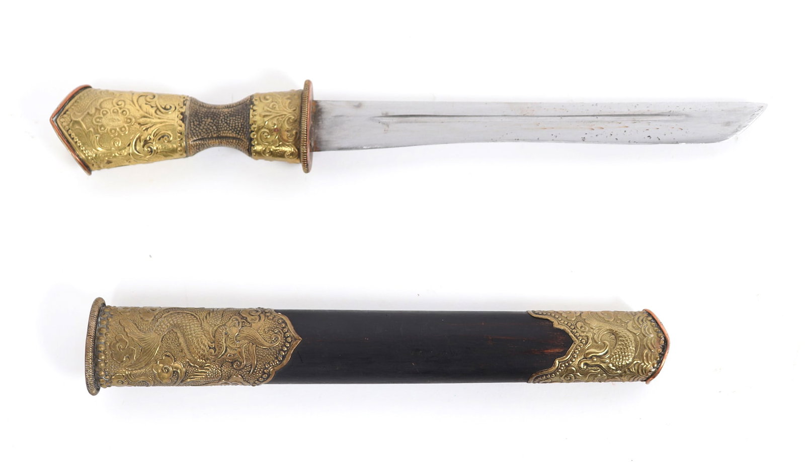 Chinese Knife with Scabbard: Chinese knife with scabbard which is in wood covered in embossed panels of dragon motif and gilt. The blade is a single edge with a thin central fuller. Guard in copper or brass with gold color decora