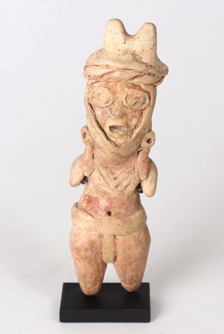Tlatilco Standing Male Figure, 1150 BCE-550 BCE: Pre-Columbian, Valley of Mexico 1150 BCE-550 BCE Standing male figure (Type K) wearing horned helmet, ear spools, and loin cloth. Probably a ballplayer with remnants of red cinnabar paint to body. Siz
