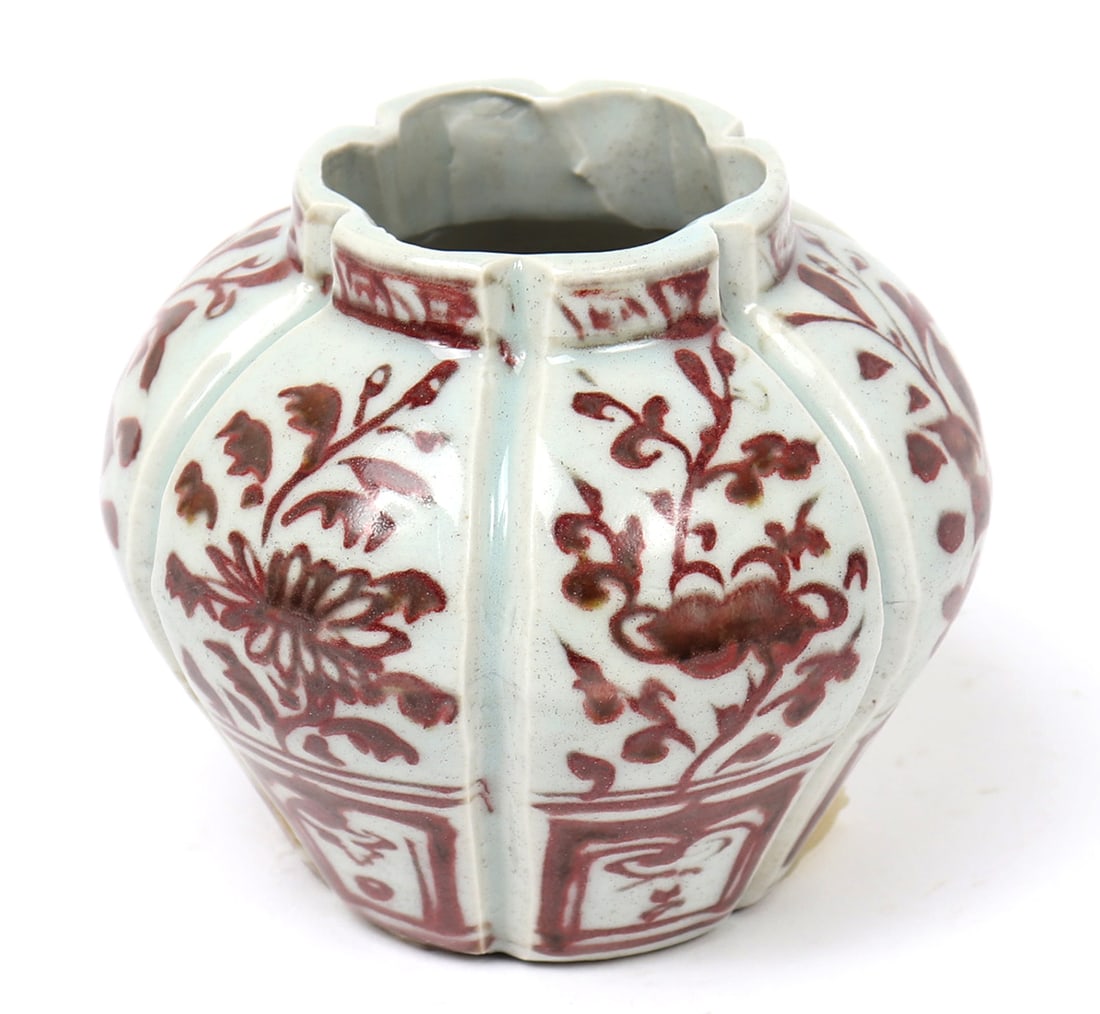 Miniature Beautiful Chinese Red Underglaze Pot: Hand thrown Chinese red underglaze pot or ink well, with deep angled ribs, blooming flowers, and geometric designs throughout. Due to the size this piece was likely used for dipping brushes into water