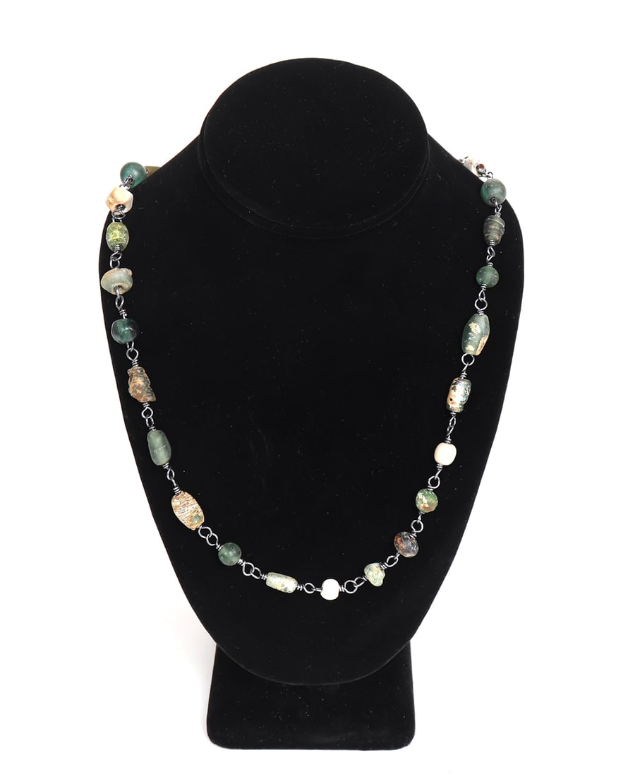 Viking Green Glass Rosary Necklace: A bountiful strand of ancient Viking glass beads are strung in modern times with an oxidized sterling silver chain. The glass beads vary from bright green to light cream colored beads. Size 26" L